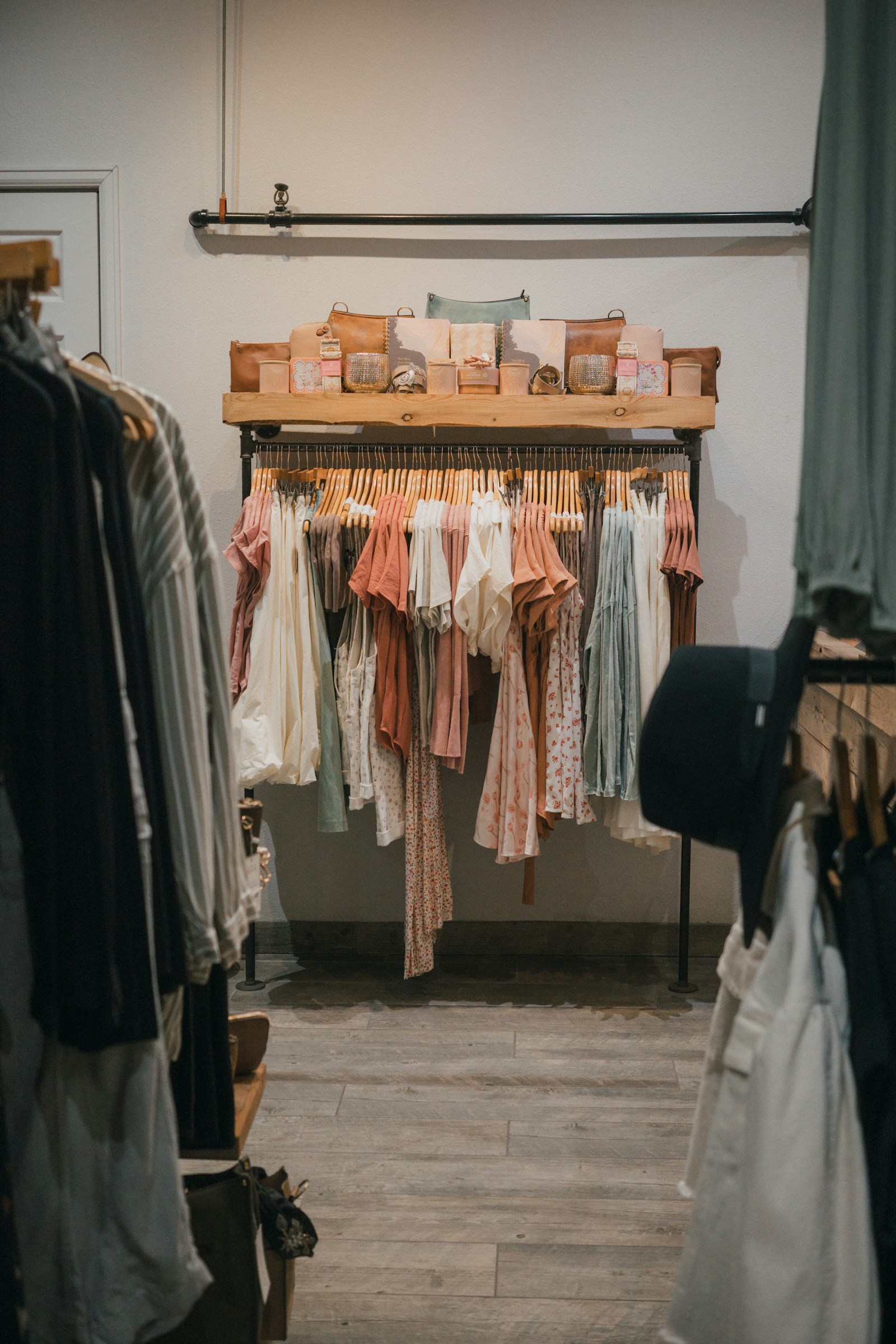 Women's boutique apparel displayed in warm light